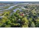 Breathtaking aerial view of the home nestled amongst lush trees, offering serenity and natural beauty at 1522 Inland Ave, Charleston, SC 29412