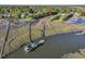 Stunning aerial view of the home with a private dock and gorgeous marsh views at 1522 Inland Ave, Charleston, SC 29412