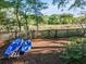 Fenced backyard includes two kayaks for exploring nearby waterways at 1522 Inland Ave, Charleston, SC 29412
