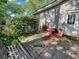 Cozy backyard patio area with a small red table and chairs at 1522 Inland Ave, Charleston, SC 29412