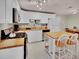 Well-lit kitchen with butcher block counters and white cabinetry at 1522 Inland Ave, Charleston, SC 29412