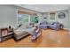 Comfortable living room with large windows and hardwood floors at 1522 Inland Ave, Charleston, SC 29412