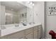 Bathroom with double sinks, a large mirror, vanity lighting and a glass-enclosed shower at 153 Wild Holly Dr, Moncks Corner, SC 29461