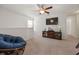 Upstairs bonus room with TV, ceiling fan, a comfortable papasan chair, and lots of light at 153 Wild Holly Dr, Moncks Corner, SC 29461