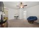 Bonus room featuring a papasan chair, an easel with a painting, and an open doorway to another room at 153 Wild Holly Dr, Moncks Corner, SC 29461