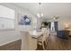 Bright dining area with white table, chandelier, and luxury vinyl flooring, adjacent to the living space at 153 Wild Holly Dr, Moncks Corner, SC 29461