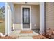 Welcoming front entrance with decorative door and clean walkway, showcasing the home's inviting facade at 153 Wild Holly Dr, Moncks Corner, SC 29461