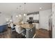 Modern kitchen featuring a granite island, stainless steel appliances, and sleek white cabinetry at 153 Wild Holly Dr, Moncks Corner, SC 29461