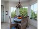 Cozy breakfast nook with lots of natural light and seating for four at 1531 Murphys Island Ct, Awendaw, SC 29429