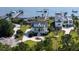 Beautiful aerial view of home with well manicured lawn and circular driveway at 1531 Murphys Island Ct, Awendaw, SC 29429