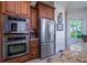 Kitchen with stainless steel appliances, including double ovens and refrigerator at 1531 Murphys Island Ct, Awendaw, SC 29429