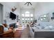 Bright, open living room with high ceilings, fireplace, and beautiful water views at 1531 Murphys Island Ct, Awendaw, SC 29429
