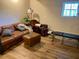 Cozy living room with leather furniture and ample space for relaxation at 1531 Murphys Island Ct, Awendaw, SC 29429