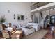 Comfortable living room area with a high ceiling, staircase, and a cozy seating arrangement at 1531 Murphys Island Ct, Awendaw, SC 29429