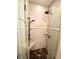 Modern shower with glass doors, sleek fixtures, a corner seat, and decorative tile accents at 1531 Murphys Island Ct, Awendaw, SC 29429