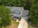 Aerial view of a well-maintained home with a lush green yard and mature trees at 186 Two Pond Loop, Ladson, SC 29456