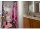Charming pink bathroom featuring a tiled shower and a cute toilet seat cover at 186 Two Pond Loop, Ladson, SC 29456