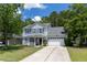 Charming two-story home with a well-manicured lawn and a two-car garage at 186 Two Pond Loop, Ladson, SC 29456