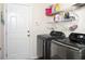 Laundry room with modern washer and dryer, plus convenient shelving at 186 Two Pond Loop, Ladson, SC 29456