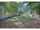Expansive backyard with a swing set and lush landscaping at 2010 Culver Ave, Charleston, SC 29407