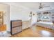 Charming bedroom features light hardwood floors, a white brick wall with niches, and a ceiling fan at 2010 Culver Ave, Charleston, SC 29407