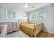 Bright Bedroom features large windows, a crib, and a full sized bed at 2010 Culver Ave, Charleston, SC 29407