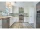 Updated kitchen features stainless steel appliances, wooden countertops, and stylish backsplash at 2010 Culver Ave, Charleston, SC 29407