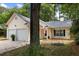 Charming single-story home showcasing a two-car garage, swing, and well-manicured lawn at 2021 Arundel Pl, Mount Pleasant, SC 29464