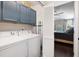 Laundry Room leading to bedroom, featuring blue cabinets, folding door, and white washer and dryer at 2021 Arundel Pl, Mount Pleasant, SC 29464