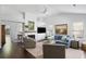 Bright living room boasts vaulted ceiling, fireplace, hardwood floors, and comfortable furniture at 2021 Arundel Pl, Mount Pleasant, SC 29464
