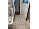 Cozy bathroom featuring black and white tiled floors, white wainscoting, and a sink at 2066 Maybank Hwy, James Island, SC 29412