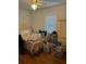 Bedroom with hardwood floors, a window, and a comfortable bed, awaiting personalized touches for a cozy retreat at 2066 Maybank Hwy, James Island, SC 29412