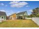 Large backyard with privacy fence, lush grass, a patio area, and a pergola at 209 Forsythia Ave, Summerville, SC 29483