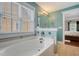 Bathroom with a large tub and jacuzzi jets in a room with soft-blue colored walls at 209 Forsythia Ave, Summerville, SC 29483