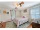 Cozy bedroom with hardwood floors, a ceiling fan, and lots of natural light at 209 Forsythia Ave, Summerville, SC 29483