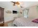 This bedroom features a ceiling fan, hardwood floors, and a television at 209 Forsythia Ave, Summerville, SC 29483