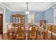 Traditional dining room with hardwood floors, a china cabinet, and classic table setting at 209 Forsythia Ave, Summerville, SC 29483