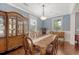 Traditional dining room with hardwood floors and ornate wood table set for eight at 209 Forsythia Ave, Summerville, SC 29483