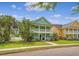 Charming two-story home with a welcoming double front porch and manicured lawn at 209 Forsythia Ave, Summerville, SC 29483