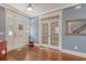 Inviting foyer with hardwood floors, a view of the staircase and a charming set of french doors at 209 Forsythia Ave, Summerville, SC 29483