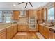 Modern kitchen with stainless steel appliances, granite countertops, and custom cabinetry at 209 Forsythia Ave, Summerville, SC 29483