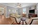 Bright living room with hardwood floors, neutral paint, and comfortable seating at 209 Forsythia Ave, Summerville, SC 29483