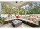 Spacious screened porch with outdoor seating and view of backyard at 209 Forsythia Ave, Summerville, SC 29483