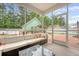 Inviting screened porch with outdoor seating and view of fenced backyard at 209 Forsythia Ave, Summerville, SC 29483