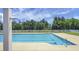 Outdoor community swimming pool with a shower area and landscaping at 209 Forsythia Ave, Summerville, SC 29483