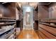Spacious walk-in closet features custom shelving, wood floors, and ample storage space at 209 Forsythia Ave, Summerville, SC 29483