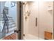 Elegant tiled shower with glass enclosure and sophisticated fixtures at 21 1/2 Pitt St, Charleston, SC 29401