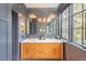 Bright bathroom features a double sink vanity and a serene window view at 21 1/2 Pitt St, Charleston, SC 29401