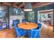 Elegant dining room with hardwood floors, brick accent wall, fireplace, and modern light fixture at 21 1/2 Pitt St, Charleston, SC 29401