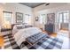 The bedroom features a hardwood floor, custom cabinet accents, and natural light at 21 1/2 Pitt St, Charleston, SC 29401